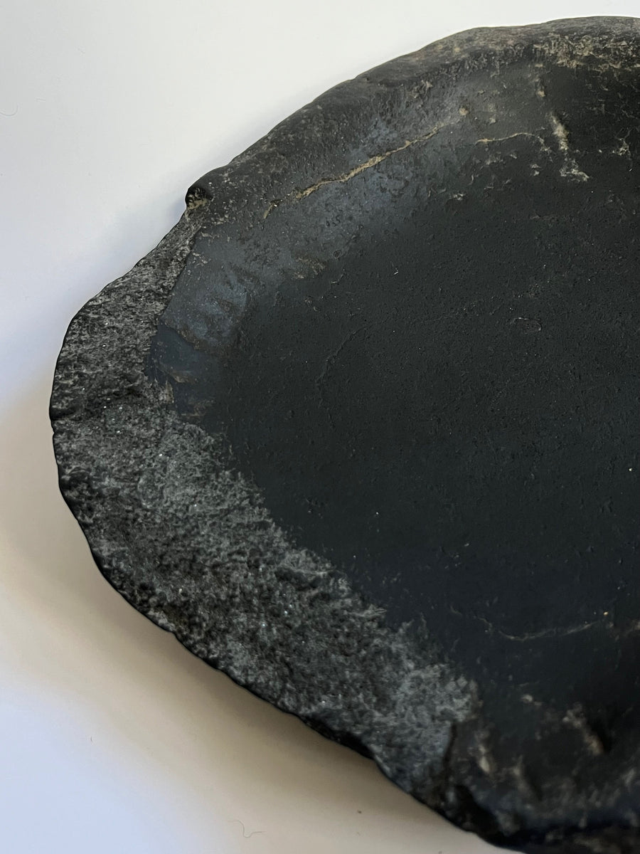Antique black stone bowl