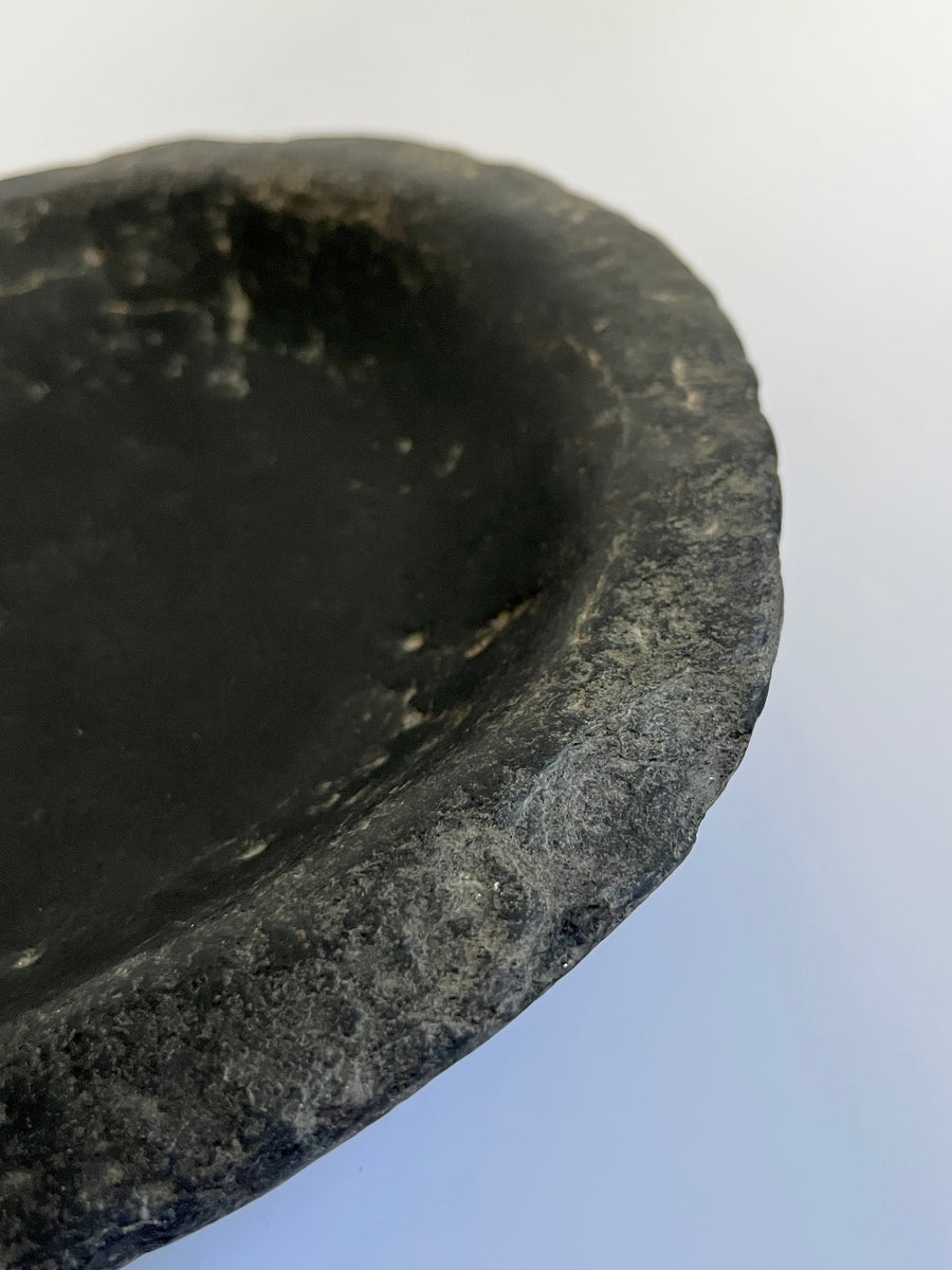 Antique black stone bowl