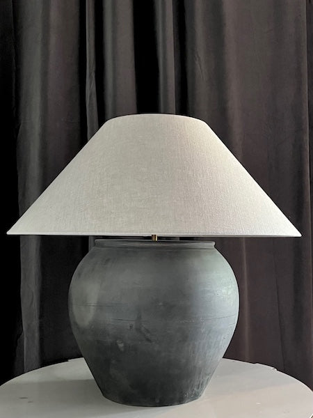 Oversized antique unglazed lamp